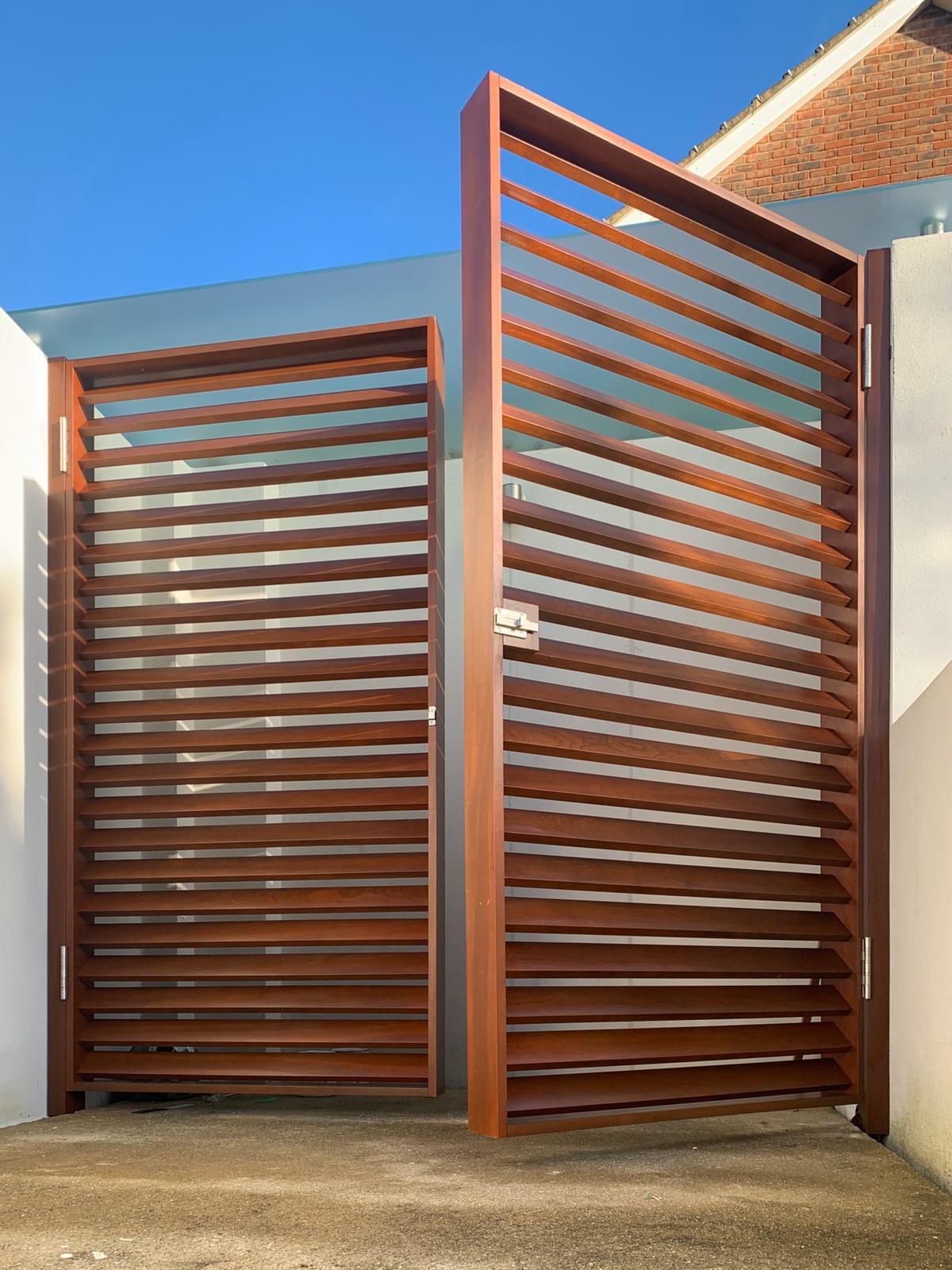 A bespoke slatted hardwood screen and gate