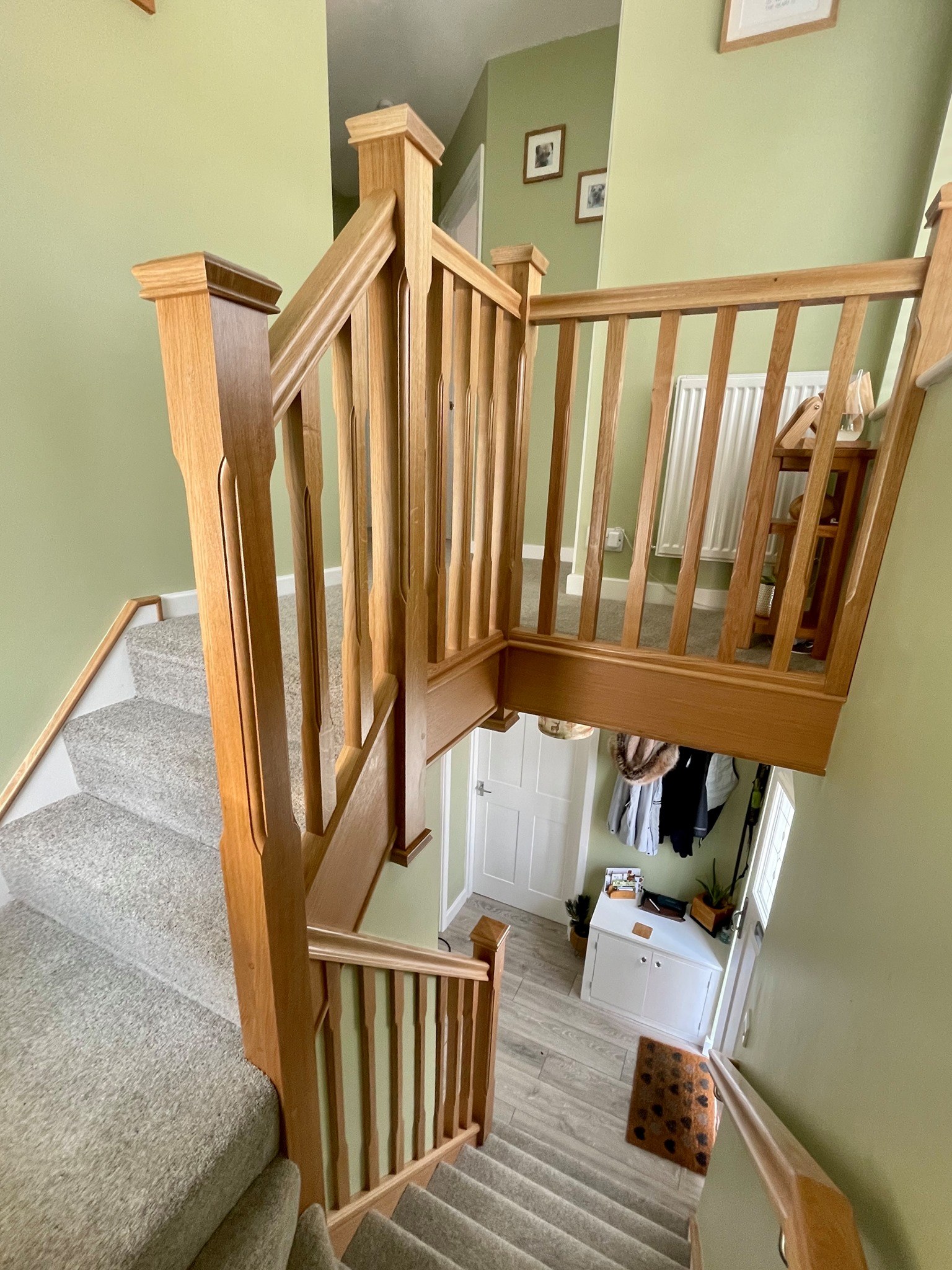 Oak spindles and newel posts around a landing, seen from above